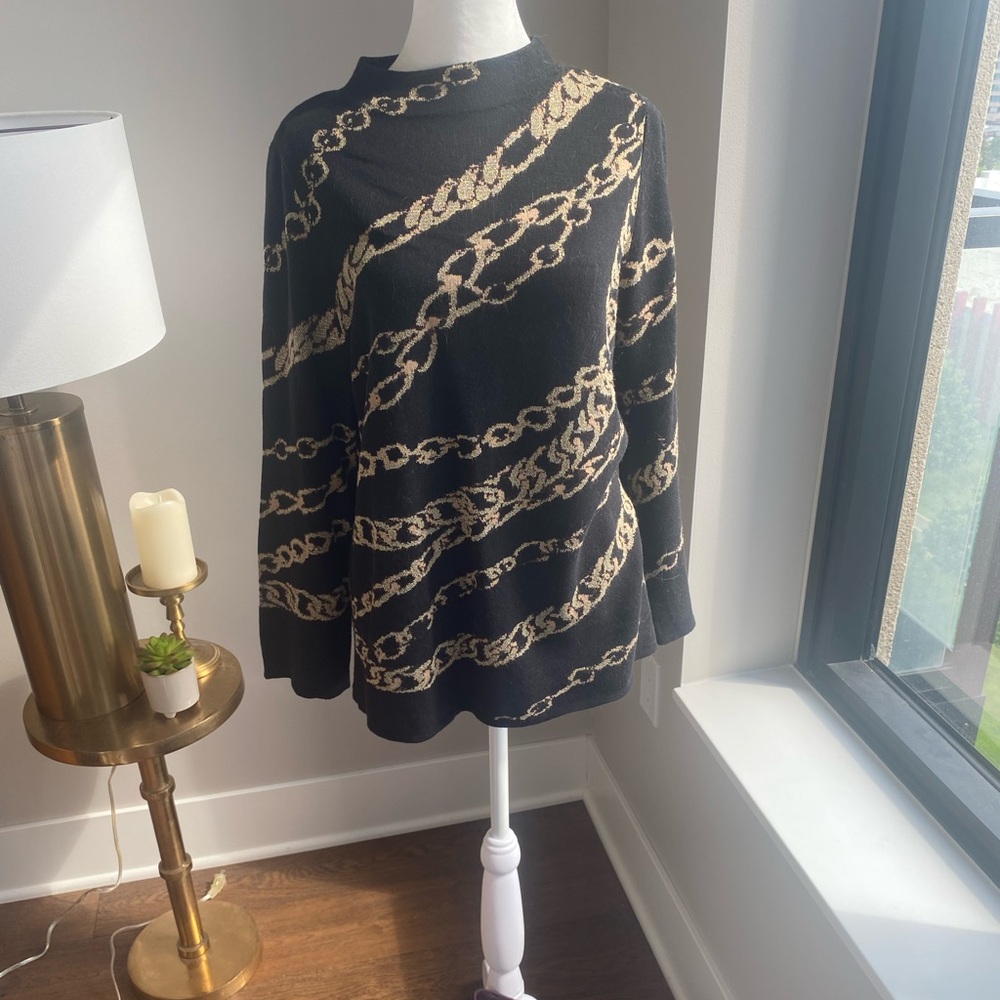 Chico’s holiday edition sweater in size 1 (Chico’s M). Runs small.